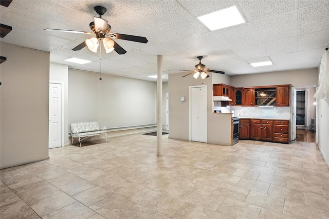 228 Pacific St, Brooklyn, NY 11201 - kitchen with a ceiling fan, decorative backsplash, glass insert cabinets, light countertops, and under cabinet range hood