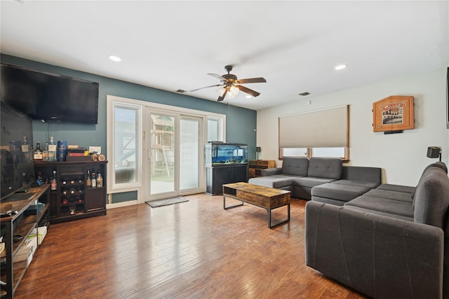 76 Cadman Ave, Babylon, NY 11702 - living area with healthy amount of natural light, a ceiling fan, wood finished floors, and recessed lighting