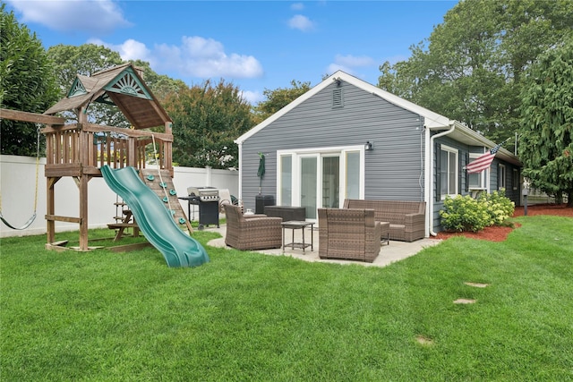 76 Cadman Ave, Babylon, NY 11702 - back of property with a playground, outdoor lounge area, and brick siding