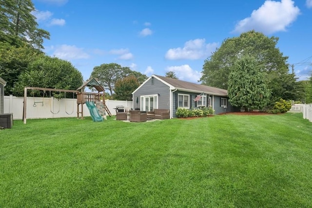 76 Cadman Ave, Babylon, NY 11702 - back of house featuring an outdoor living space, a fenced backyard, and a playground