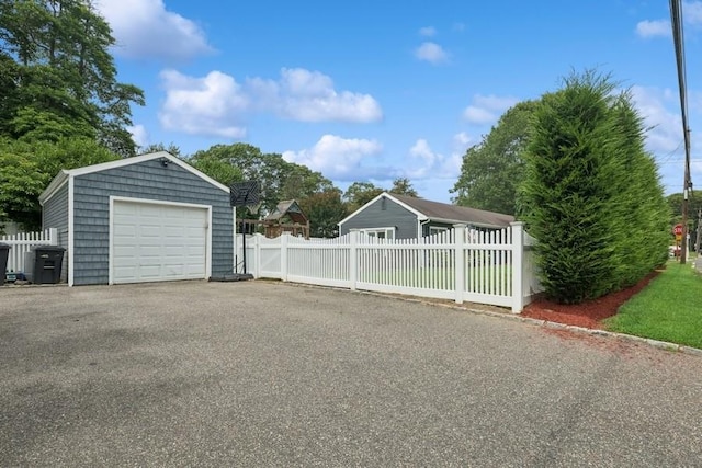 76 Cadman Ave, Babylon, NY 11702 - detached garage with asphalt driveway