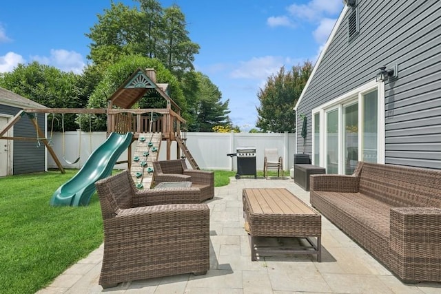 76 Cadman Ave, Babylon, NY 11702 - fenced backyard featuring a playground, area for grilling, and a patio