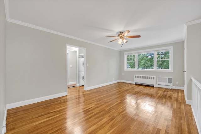 77-17 Springfield Blvd Unit B, Bayside, NY 11364 - unfurnished room with estacked washer and dryer, ornamental molding, a ceiling fan, light wood-type flooring, and radiator