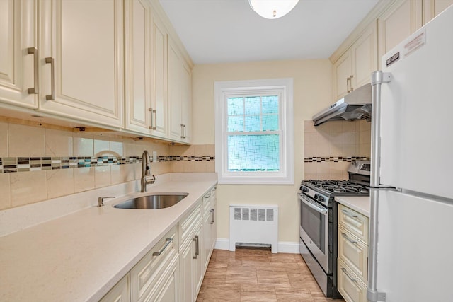 77-17 Springfield Blvd Unit B, Bayside, NY 11364 - kitchen featuring freestanding refrigerator, stainless steel gas stove, decorative backsplash, radiator, and under cabinet range hood