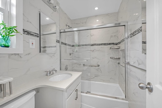 77-17 Springfield Blvd Unit B, Bayside, NY 11364 - bathroom with vanity, shower / bath combination with glass door, tile walls, and recessed lighting