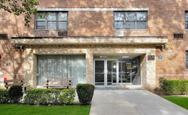 153-25 88th St Unit 1J, Howard Beach, NY 11414 - property entrance with brick siding and french doors