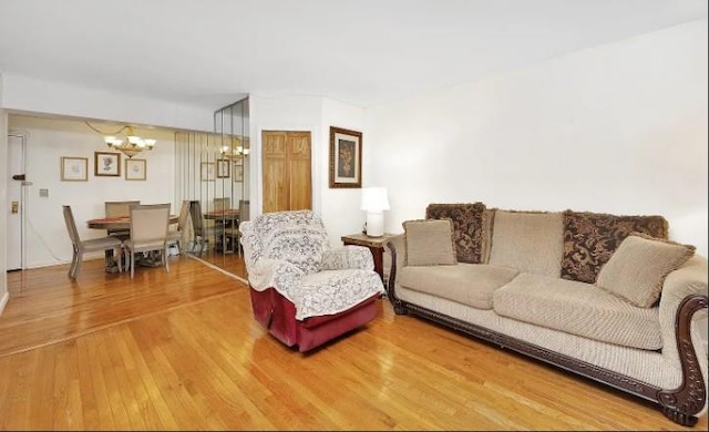 153-25 88th St Unit 1J, Howard Beach, NY 11414 - living room featuring a chandelier and wood finished floors