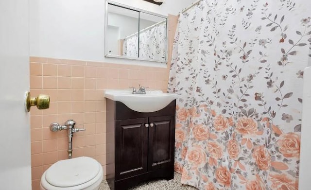 153-25 88th St Unit 1J, Howard Beach, NY 11414 - bathroom with tile walls, vanity, curtained shower, and a wainscoted wall