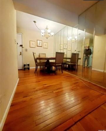 153-25 88th St Unit 1J, Howard Beach, NY 11414 - dining room with hardwood / wood-style floors and a chandelier