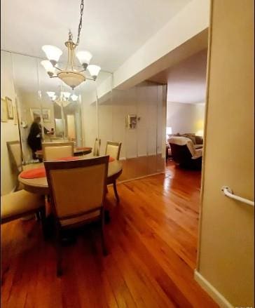 153-25 88th St Unit 1J, Howard Beach, NY 11414 - dining area with wood finished floors and a chandelier