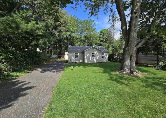 1439 Ocean Ave, Bohemia, NY 11716 - ranch-style home featuring driveway and an outdoor structure