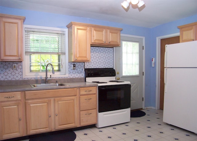 1439 Ocean Ave, Bohemia, NY 11716 - kitchen featuring light brown cabinets, electric range oven, freestanding refrigerator, and plenty of natural light