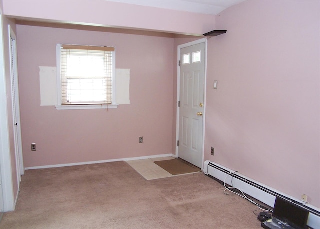 1439 Ocean Ave, Bohemia, NY 11716 - foyer with a baseboard heating unit and light colored carpet