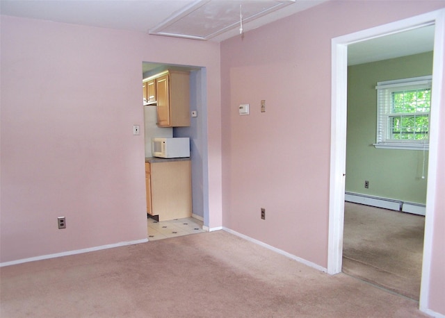 1439 Ocean Ave, Bohemia, NY 11716 - spare room featuring attic access, light colored carpet, and a baseboard heating unit