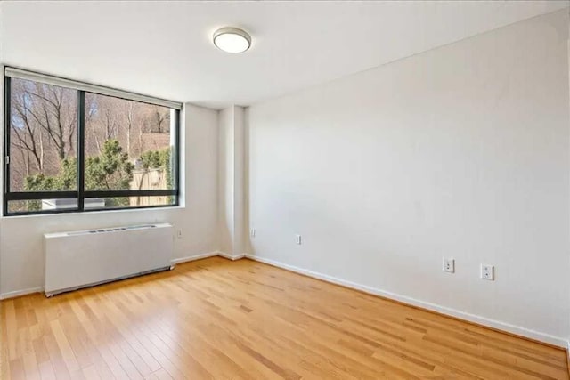 2287 Johnson Ave Unit 3A, Bronx, NY 10463 - empty room featuring radiator and wood finished floors