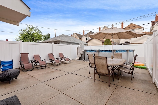 78-33 64th St, Glendale, NY 11385 - fenced backyard featuring outdoor dining space and a patio