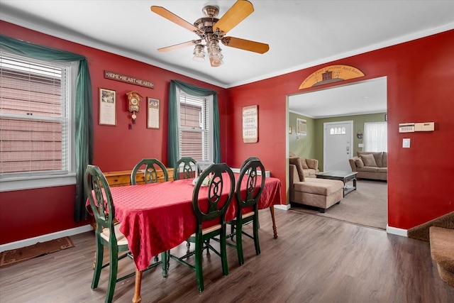 78-33 64th St, Glendale, NY 11385 - dining area with wood finished floors, ceiling fan, and crown molding