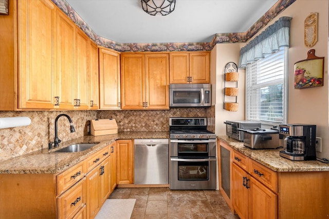 78-33 64th St, Glendale, NY 11385 - kitchen with appliances with stainless steel finishes, decorative backsplash, and light stone countertops