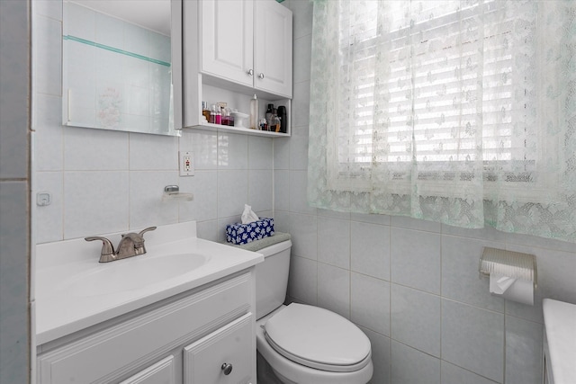 78-33 64th St, Glendale, NY 11385 - bathroom with tile walls, vanity, and backsplash