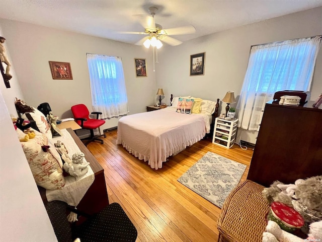 219-36 74th Ave Unit 323A1, Bayside, NY 11364 - bedroom featuring light wood-style floors and ceiling fan