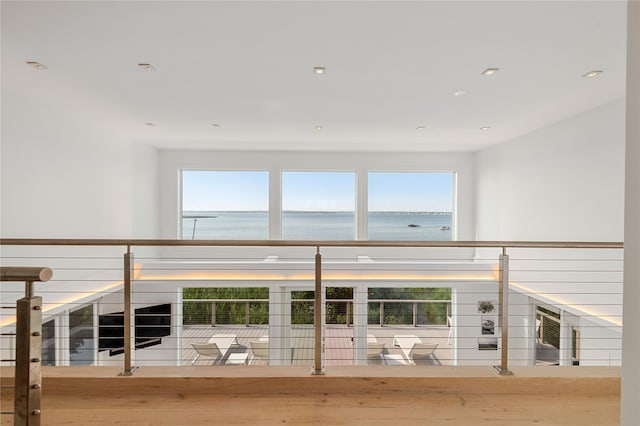 846 Dune Rd, Westhampton Dunes, NY 11978 - hall with a water view, plenty of natural light, wood finished floors, and recessed lighting