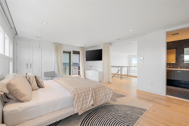 846 Dune Rd, Westhampton Dunes, NY 11978 - bedroom with light wood-style flooring, recessed lighting, and access to outside