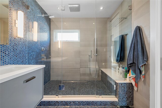 846 Dune Rd, Westhampton Dunes, NY 11978 - full bath with tile walls, vanity, and a shower stall