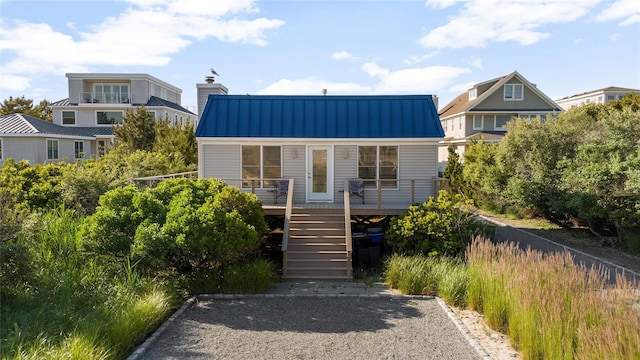 846 Dune Rd, Westhampton Dunes, NY 11978 - view of front facade featuring stairs, a metal roof, a standing seam roof, and covered porch