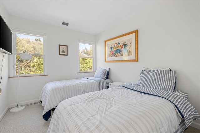 846 Dune Rd, Westhampton Dunes, NY 11978 - carpeted bedroom featuring baseboards