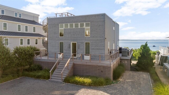846 Dune Rd, Westhampton Dunes, NY 11978 - view of front of home featuring stairway and a deck with water view