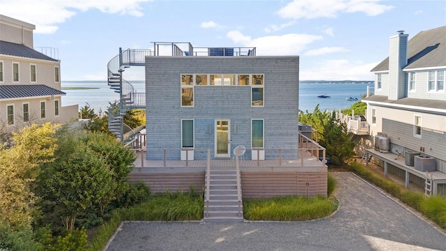 846 Dune Rd, Westhampton Dunes, NY 11978 - view of front of house with stairway and a water view