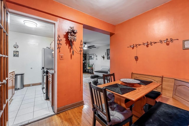 7910 34th Ave Unit 4J, Jackson Heights, NY 11372 - dining space with light wood-type flooring and a ceiling fan