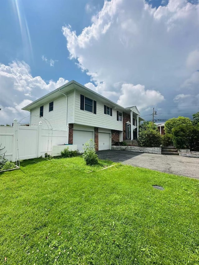 202 Nelson Ct, Syosset, NY 11791 - view of front of property with asphalt driveway, brick siding, and an attached garage