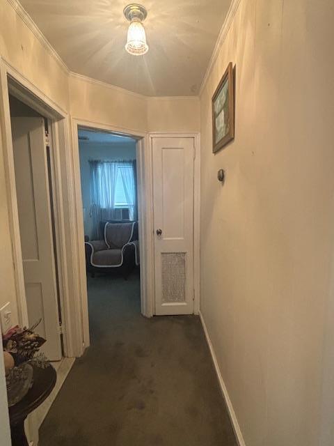 89 Hampton Ave, Albertson, NY 11507 - hallway featuring dark colored carpet and ornamental molding