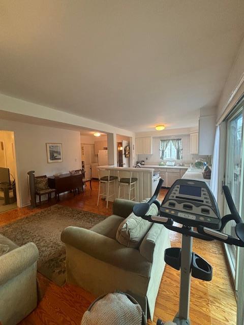 89 Hampton Ave, Albertson, NY 11507 - living room with wood finished floors
