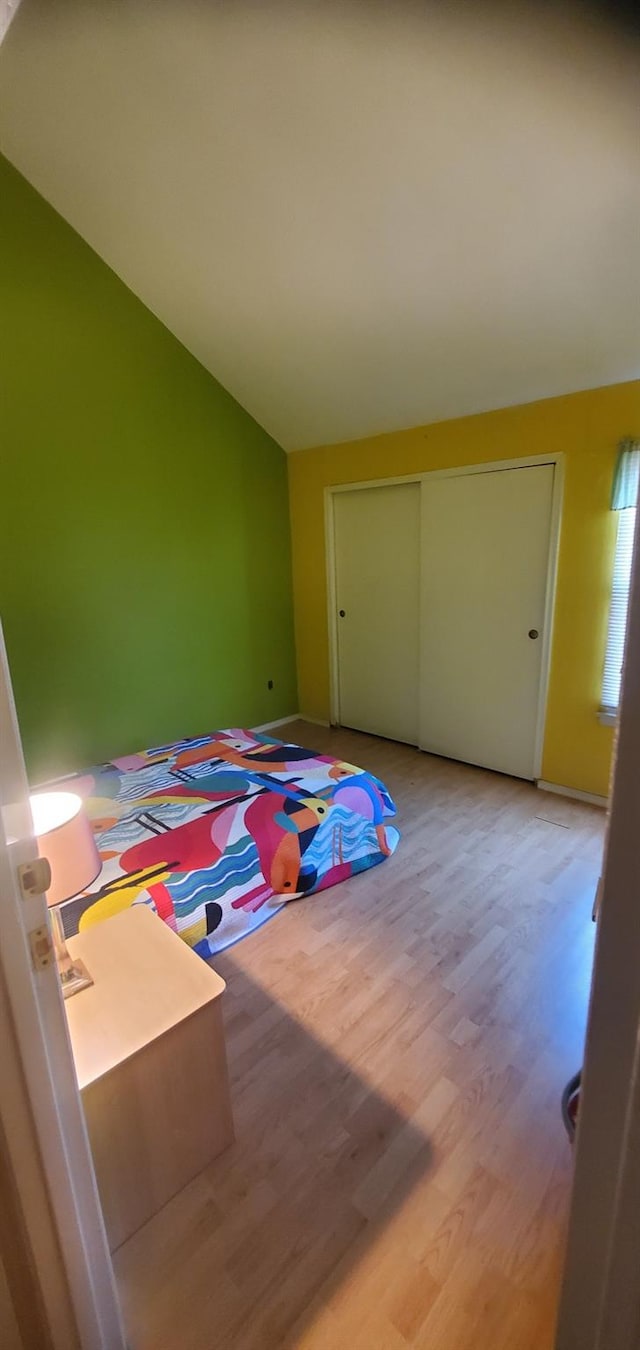 30 Chestnut Cir, Staten Island, NY 10312 - unfurnished bedroom featuring lofted ceiling, wood finished floors, and a closet