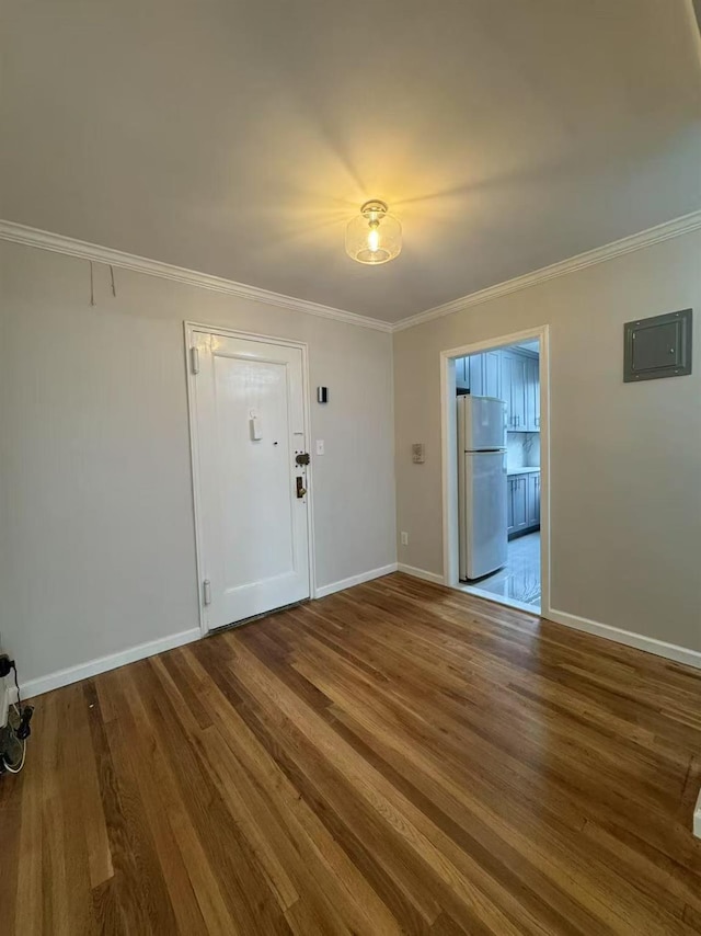 138-18 28th Rd Unit 1F, Flushing, NY 11354 - spare room with wood finished floors, crown molding, and electric panel