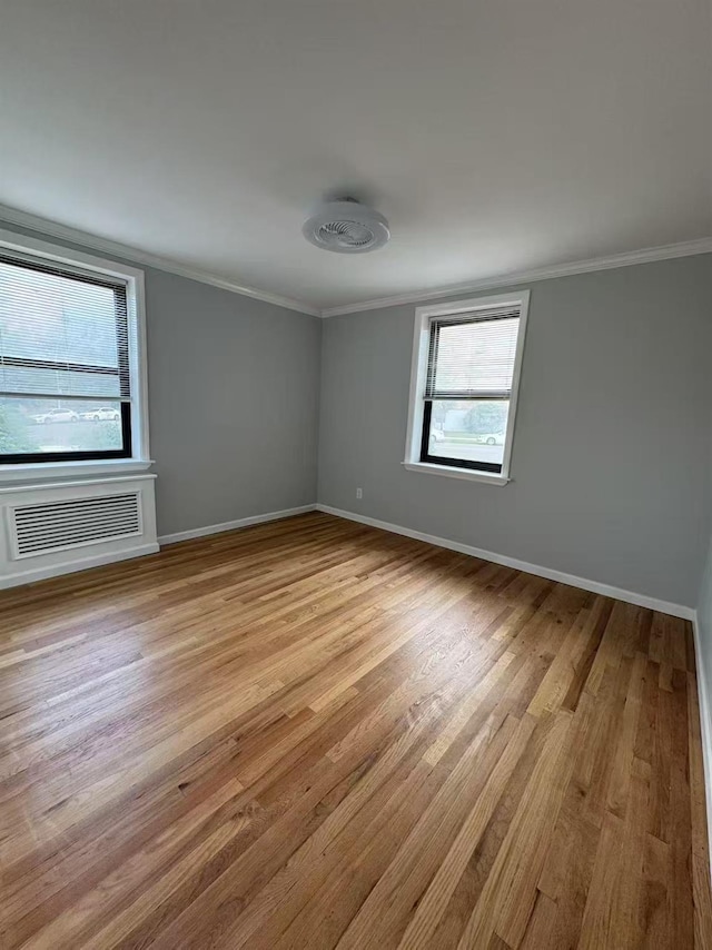 138-18 28th Rd Unit 1F, Flushing, NY 11354 - empty room featuring crown molding and light wood-style floors