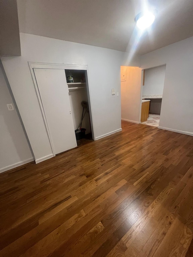 285 E 35th St Unit 2D, Brooklyn, NY 11203 - unfurnished bedroom featuring wood finished floors and a closet