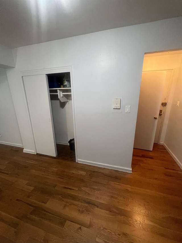 285 E 35th St Unit 2D, Brooklyn, NY 11203 - unfurnished bedroom with wood finished floors and a closet