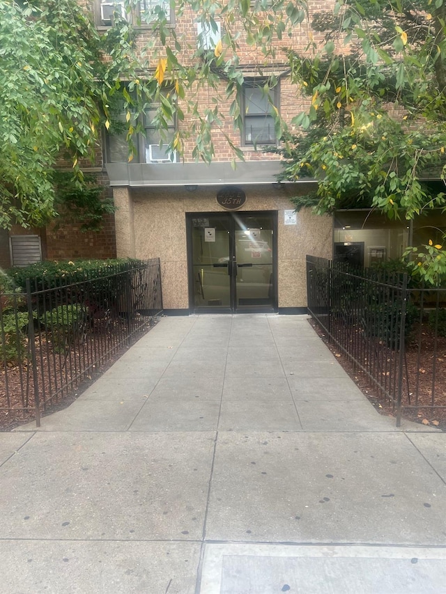285 E 35th St Unit 2D, Brooklyn, NY 11203 - exterior space with concrete driveway, a garage, and stucco siding