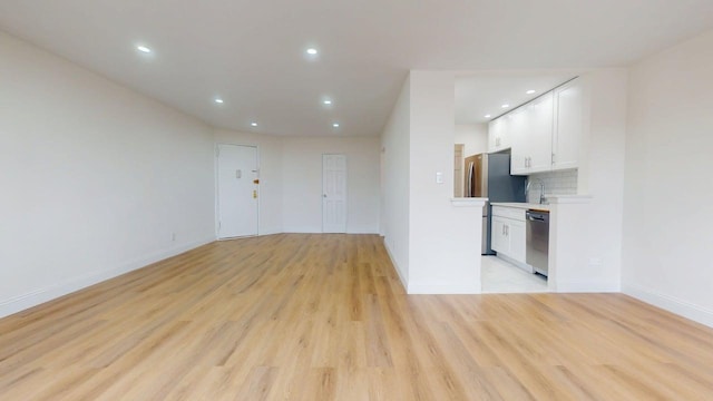 66-15 Thornton Pl Unit 6S, Rego Park, NY 11374 - unfurnished living room featuring light wood finished floors and recessed lighting