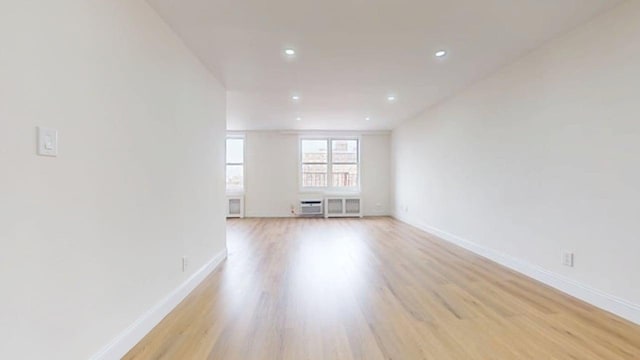 66-15 Thornton Pl Unit 6S, Rego Park, NY 11374 - unfurnished room featuring light wood-type flooring and recessed lighting