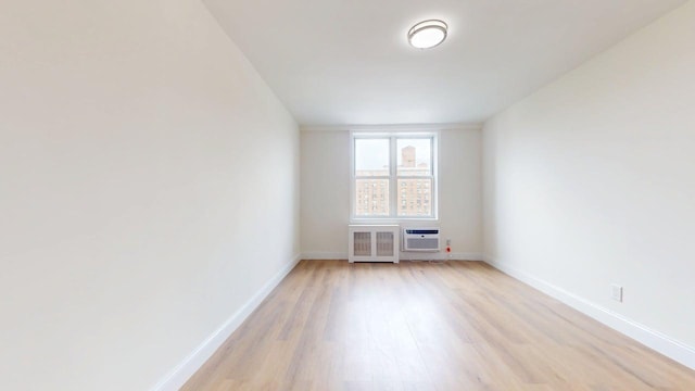 66-15 Thornton Pl Unit 6S, Rego Park, NY 11374 - empty room with light wood finished floors and radiator