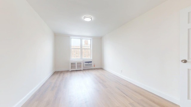 66-15 Thornton Pl Unit 6S, Rego Park, NY 11374 - empty room featuring light wood-style flooring and radiator heating unit
