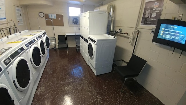 66-15 Thornton Pl Unit 6S, Rego Park, NY 11374 - communal laundry room featuring estacked washer and dryer, washer and dryer, and concrete block wall