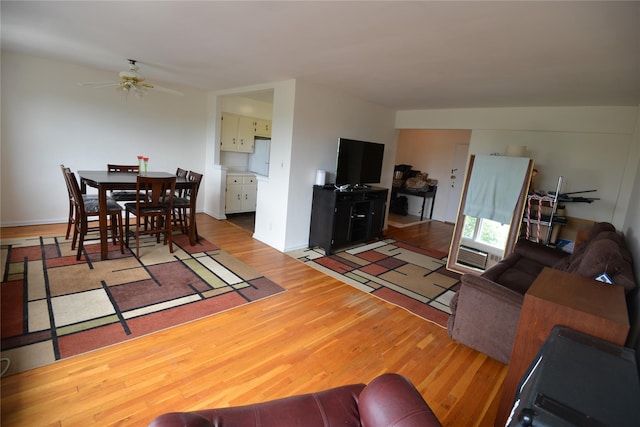 100 S Ocean Ave Unit 4A, Freeport, NY 11520 - living area featuring wood finished floors and ceiling fan