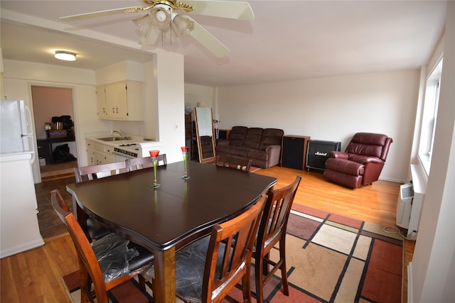 100 S Ocean Ave Unit 4A, Freeport, NY 11520 - dining space featuring wood finished floors and ceiling fan