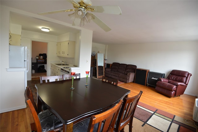100 S Ocean Ave Unit 4A, Freeport, NY 11520 - dining space featuring light wood-style floors and a ceiling fan