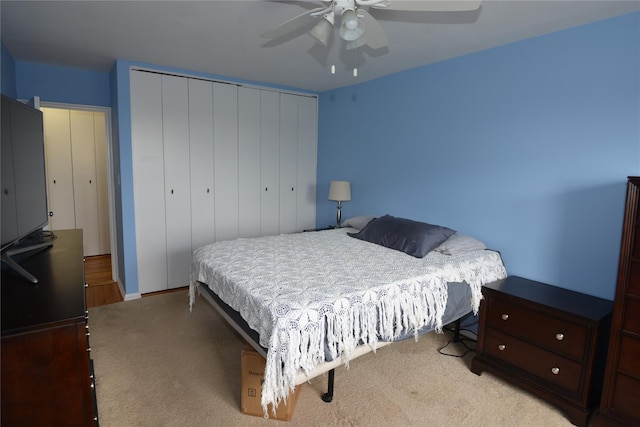 100 S Ocean Ave Unit 4A, Freeport, NY 11520 - bedroom featuring light carpet, a closet, and a ceiling fan